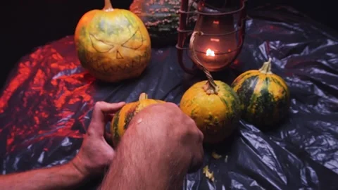 Time-lapse video cutting art scary halloween pumpkins and old kerosene lamp Stock-Footage 286207971
