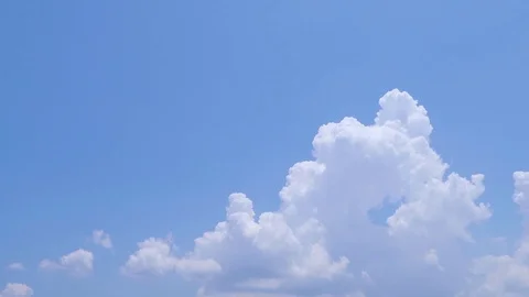 Time-lapse video of fast moving white and fluffy clouds Stock Footage 117438126