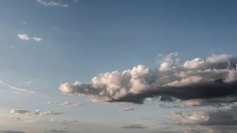 Time lapse video of fluffy cumulus clouds against a blue sky. Stock Footage 193553138