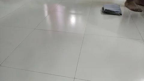 A time lapse video of folding clothes in a house and throwing it on floor Stock Footage 111030356