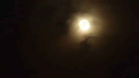 Time lapse video of full moon rising and clouds passing by Stock Footage 82088851