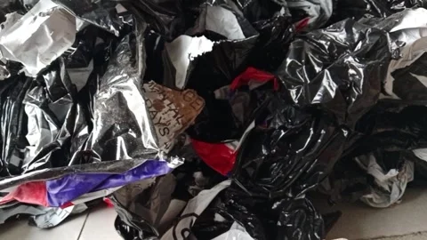 Time-lapse video of a growing pile of used shipping bags Stock Footage 340331464