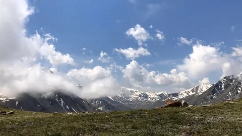 Time lapse  video of heavenly cloudscape over Mountains. Stock Footage 77984900
