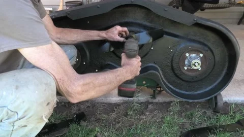 A Time Lapse Video of Installing Lawnmower Blades Stock-Footage 156702232