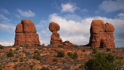 Time lapse video loop of moving clouds and sky. Balanced Rock formation in Stock Footage 346788542