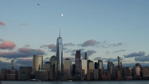 Time-lapse video of the moon rising at sunset next to the World Trade Center Stock Footage 71130245
