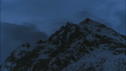 Time lapse Video of a mountain peak covered with snow at night.  Stock Footage 127944127