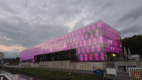 Time lapse video of the Museum of Modern Art at sunset in Linz, Austria Stock Footage 70793437