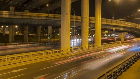 Time lapse video of night traffic on the urban thoroughfare   and road juncti Stock Footage 80643099