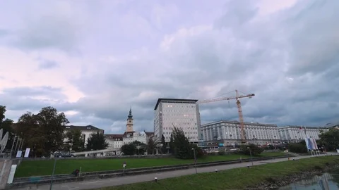 Time lapse video of nightfall on the banks of the Danube River in Linz, Austria Stock Footage 70793341