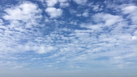 Time lapse video at noon, with the sky bright blue and white. Beautiful cloud mo Stock Footage 113066189