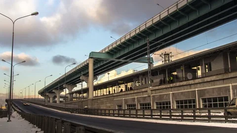 Time lapse video of overpass with moving train, traffic and station Stock Footage 70565274