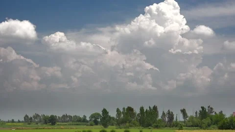 Time lapse video of partly cloudy blue sky - Field Cultivation and Farm Scenery Stock Footage 339489060