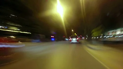 Time lapse video of a point of view car riding in the city at night Stock Footage 82095651