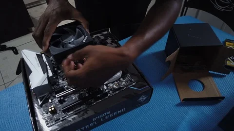 Time-lapse video of a processor cooler being placed on the motherboard of Stock Footage 113248163