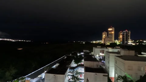 Time lapse video showing clouds moving over a small town Stock Footage 337791794