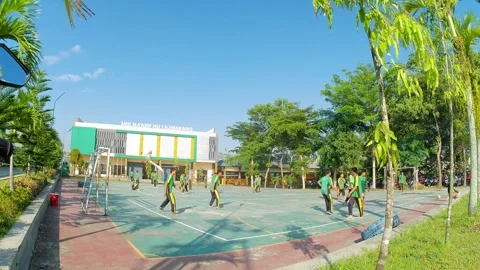 Time lapse video of SMK students playing futsal, takraw, and volleyball 스톡 동영상 243020499