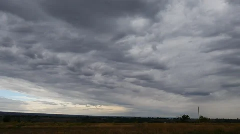 Time lapse video of a storm rolling in with dark gray clouds. Stock Footage 55495270