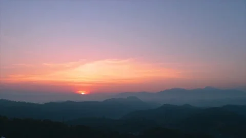 Time-Lapse Video - The Sun Rises Over The Mountains And Clouds On a Foggy Day Stock Footage 170154676