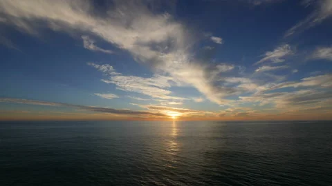 Time lapse video of sunset over the ocean in 4k Stock Footage 166113887