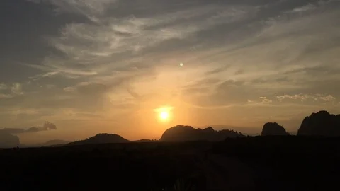 Time lapse video at sunset, with the sky blue, orange and red. Beautiful cloud m Stock Footage 113067140