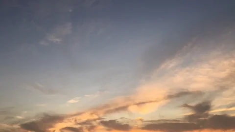 Time lapse video at sunset, with the sky blue, orange and red. Beautiful cloud m Stock Footage 113067241