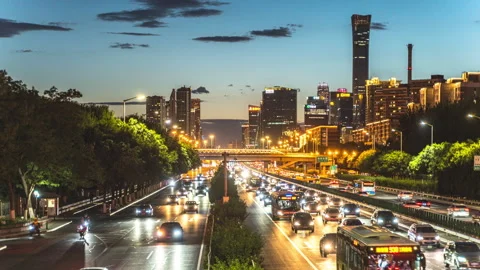 Time-lapse video of traffic flow at night in Beijing CBD building, China Stock Footage 246097747