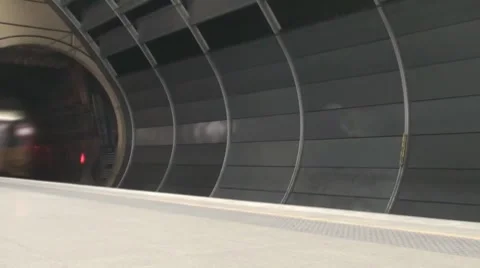 Time-lapse video of a train emerging from a tunnel Stock Footage 7138451