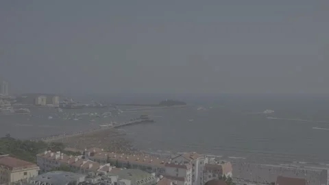 Time-lapse video, watching the seaside city from a distance Stock Footage 336796195