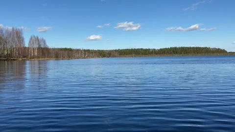 Time-lapse video of waves on a beautiful large forest lake in early spring Stock Footage 220913241