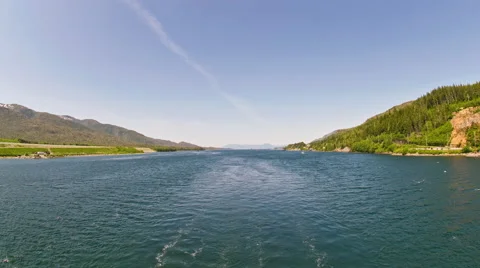Time-lapse view from the back of a cruise ship in a narrow channel near Stock Footage 52217051