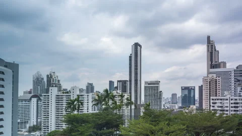 Time lapse view of Bangkok high-rises  on cloudy day with moving clouds Stock Footage 230910268