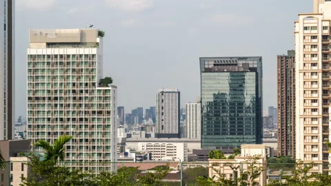 Time lapse view of Bangkok high-rises  on cloudy day with moving clouds Stock Footage 230910458