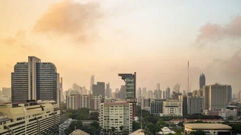 Time lapse view of Bangkok high-rises  during sunset with moving clouds Stock Footage 230912683
