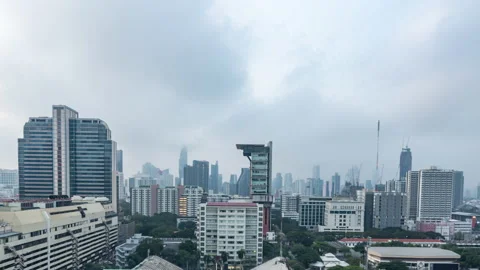 Time lapse view of Bangkok high-rises  on cloudy day with moving clouds Stock Footage 230913022