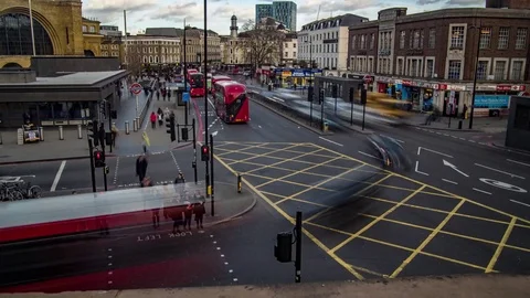 Time lapse view of a busy crossroad by King's Cross station in London Stock Footage 85460095