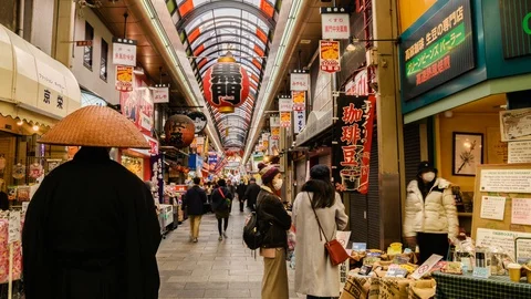 Time-lapse view of the busy Kuromon market shopping street in Osaka, Japan Stock Footage 127613538