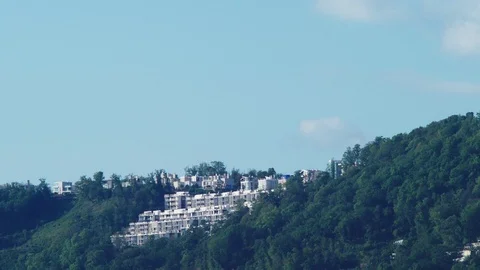 Time lapse. A view of the clouds above the mountain through the hot air Stock Footage 95448142