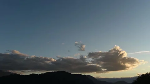 Time lapse view of clouds gathering over mountains Stock Footage 63303786