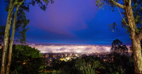 Time Lapse of view of clouds moving over cityscape, Guatemala City Stock Footage 64401510