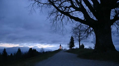 Time lapse view of clouds moving over famous church in Jamnik, Slovenia Stock-Footage 143955462