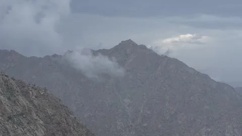 Time lapse view clouds over the mountains Stock Footage 263277778