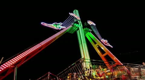 Time Lapse view of a colorful fun fair attraction at night 動画素材 21315783