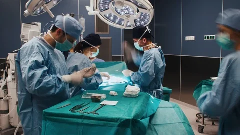 Time lapse view of difficult operation of busy surgeons Stock Footage 104655919