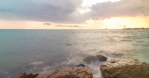 Time lapse view of Epic warm sunset clouds over the sea at Ladispoli, Italy Stock Footage 243966788