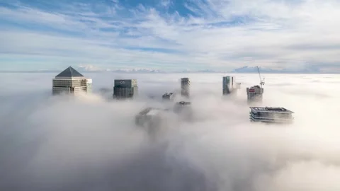 Time lapse view of fog between the office skyscrapers at Canary Wharf Stock Footage 266130447