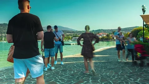 Time Lapse of View of the Grada Lake from Bardolino with people Stock Footage 139511572