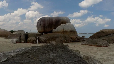 Time-lapse view of a group of big stones on the Tanjung Tinggi beach Stock Footage 101545557