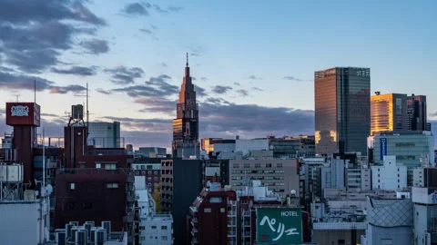 Time lapse view of high-rises in Tokyo, Japan during colorful morning sunrise Stock Footage 295736467