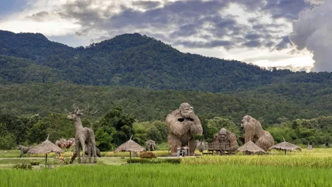 Time lapse view of Huay Thung Tao's famous large animal straw sculptures Stock Footage 218307872